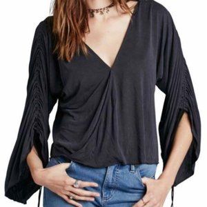Free People blue “Salt n Peppa" wrap‎ top size S
